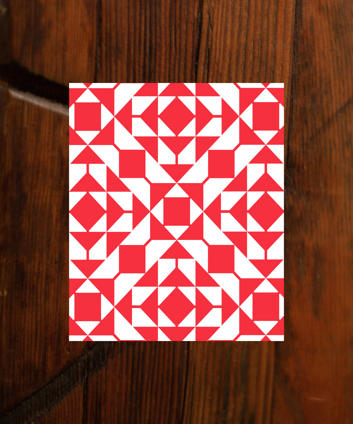 This image features a visually striking package design for "GRACELAND BLEND," a versatile coffee blend from De La Paz. The package showcases a vibrant red and white geometric pattern that adds a modern and artistic flair.