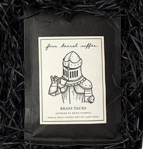 BRASS TACKS SUBSCRIPTION coffee bag featuring an illustration of a knight drinking from a cup, centered in black paper filler.