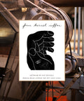 Four Barrel Coffee bag featuring a black graphic illustration of a hand, with text identifying the artist, Nat Russell, and the 12 ounce net weight.
