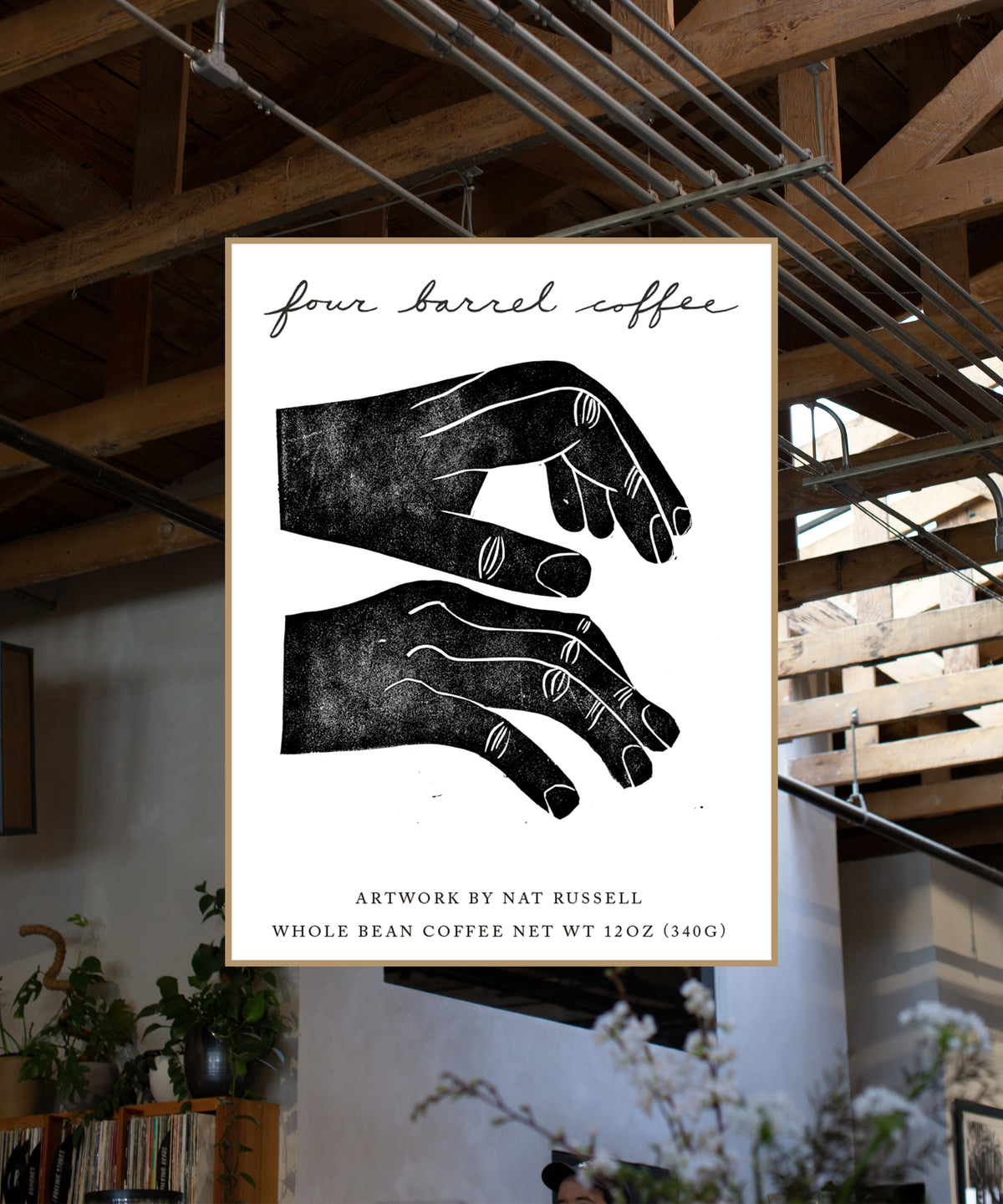 Poster with black and white illustration of hands and 'four barrel coffee' text in a modern indoor setting.
