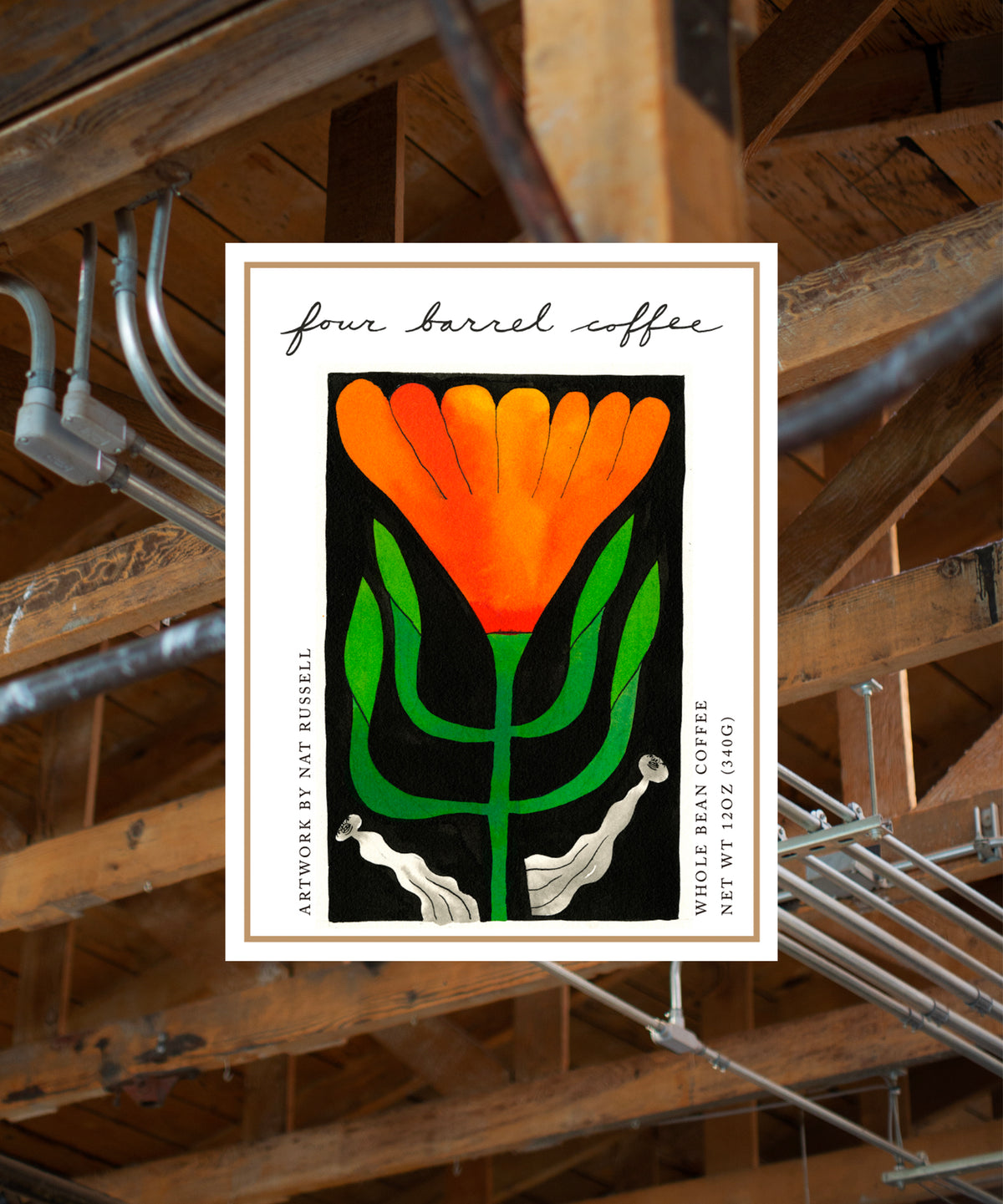 Four Barrel Coffee label with orange flower design on a wooden background