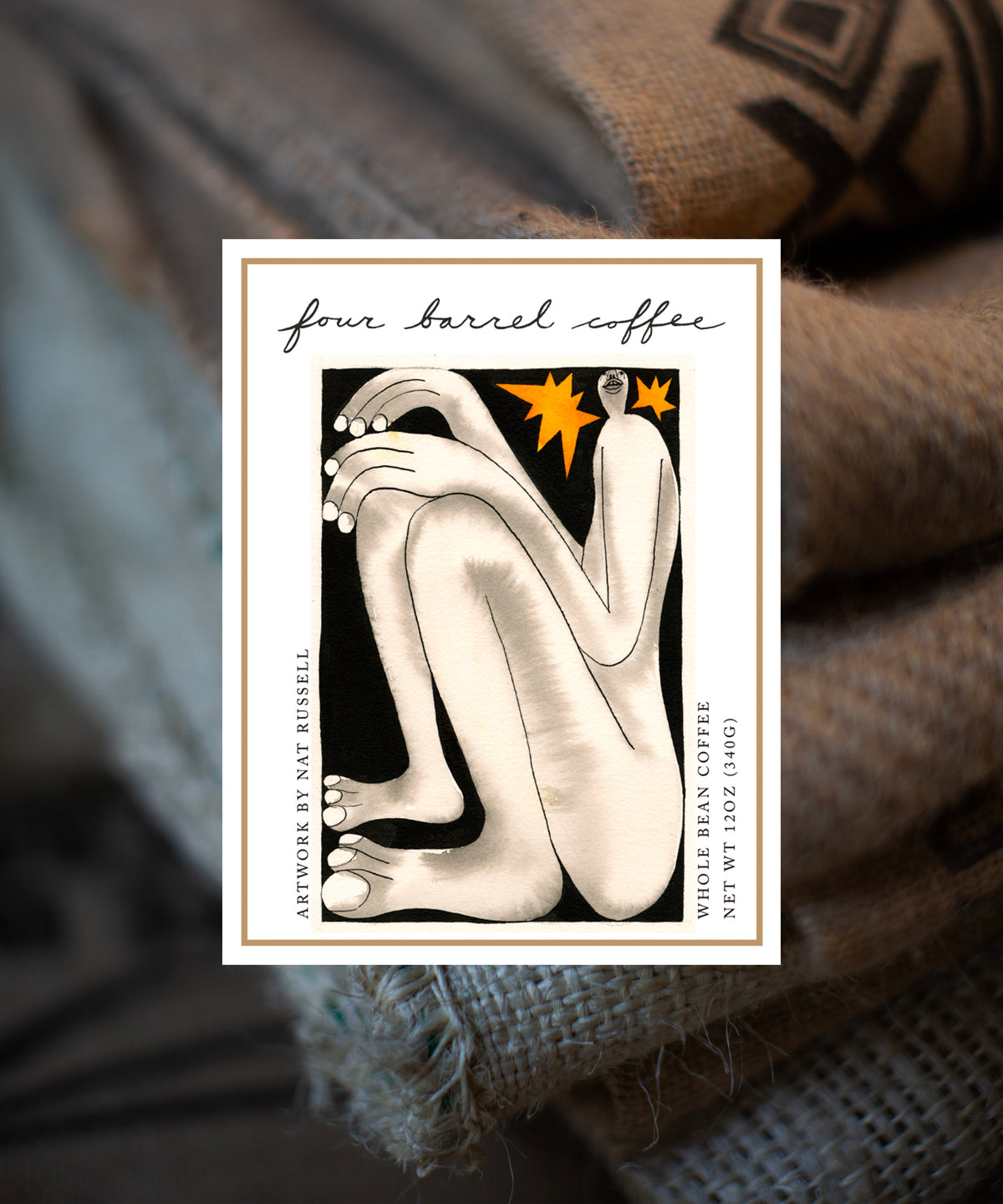 Four Barrel Coffee label with abstract design on a textured fabric background