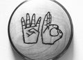 BT Wedge Espresso Distribution Tool, a circular metal tool featuring a laser-etched design of two hands spelling WD in American Sign Language.