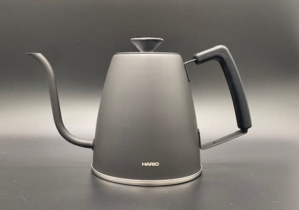 A black Hario 'Smart G' Drip Kettle on a gray background.